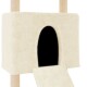 Ein cremefarbener Katzenhaus mit einem schwarzen Eingang, ausgestattet mit einer Rampe, die zu ihm führt, entworfen für den Komfort von Haustieren.