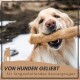 Ein Golden Retriever hält glücklich einen großen Kau-Knochen im Mund, mit dem Text 'VON HUNDEN GELIEBT für langanhaltendes Kauvergnügen' darunter.