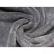 Weiche, graue Tierdecke mit einer plüschigen Textur, in einem spiralförmigen Muster angeordnet.