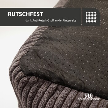 Nahaufnahme eines strukturierten grauen Haustierbettes mit einer schwarzen rutschfesten Unterseite. Text: "RUTSCHFEST dank Anti-Rutsch-Stoff."