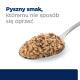Kremowa łyżka karmy dla zwierząt z napisem "Pyszny smak, któremu nie sposób się oprzeć."