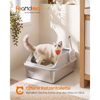 Flauschige weiß-beige Katze in einer grauen offenen Katzentoilette mit Schaufel; sichtbarer Text: „feandrea“ und „Offene Katzentoilette“.