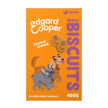 Die Verpackung von Edgard Cooper Bravo Biscuits zeigt einen braunen und grauen Cartoon-Hund mit "Crunch Crunch" und "Kein Zuckerzusatz. JA, WIRKLICH." auf Orange.