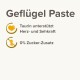 Geflügelpaste mit dem Text 'Taurin unterstützt Herz- und Sehkraft' und '0% Zucker-Zusatz' auf einem hellen Hintergrund.