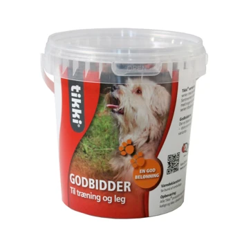 Ein klarer Kunststoffbehälter mit Hundeleckerlis, beschriftet mit "tikki! GODBIDDER" und dem Untertitel "Til træning og leg," mit einem glücklichen Hund auf der Vorderseite.