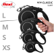 Schwarze Flexi-Retractable-Hundeleinen in den Größen L, M, S und XS, mit einer Hand, die die mittlere Größe hält. Text: "NEUE KLASSIKER GURT."