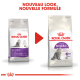 Deux sacs de nourriture pour chats Royal Canin étiquetés "Sensible" et "Regular Sensible", avec une flèche rouge pointant vers une nouvelle formule et un nouveau design.