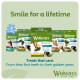Whimzees dental dog treats packages with "Smile for a lifetime" header and "Treats that care" text.