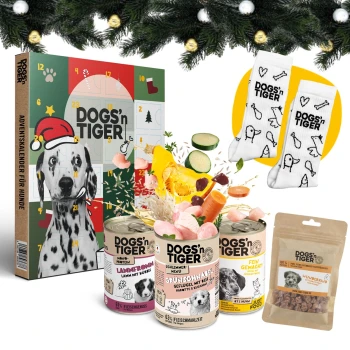 Dogs´n Tiger, Adventsbundle Welpen Adventskalender für Hunde von DOGS'n TIGER, mit Hundefutterdosen, bunten Snacks und thematischen Socken, vor einem festlichen Hintergrund.