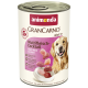 Blik Animonda GranCarno Adult 1+ hondenvoer, Multi Meat Cocktail smaak, met afbeelding van een golden retriever en stukjes vlees.