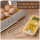 Braune Eier in einem Brutgerät mit Sonde und gelbem Thermometer, das 37,5 °C anzeigt; Beschriftung 'Temperaturbereich 32–42 °C'