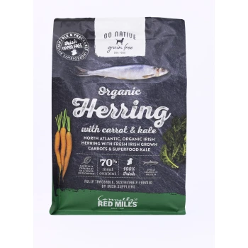 Bag of Go Native grain-free dog food featuring organic herring with carrots and kale, highlighting 70% meat content and 100% Irish ingredients.
