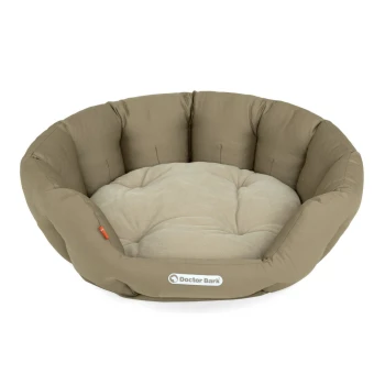 Ein rundes, plüschiges Hundebett in einem beige-braunen Farbschema, mit einem weichen, gepolsterten Innenraum und einem Logo, das "Doctor Bark" liest.