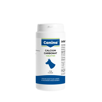 Weiße Canina-Flasche mit 'Calcium Carbonat Tabletten' für Hunde mit blauer Hundesilhouette; Etikett: 'Canina', 'Calcium Carbonat Tabletten', 'Für Hunde'.