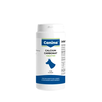Weiße Canina-Flasche mit 'Calcium Carbonat Tabletten' für Hunde mit blauer Hundesilhouette; Etikett: 'Canina', 'Calcium Carbonat Tabletten', 'Für Hunde'.