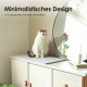 Eine graue getigerte Katze entspannt sich auf einer weichen Matte auf einem weißen Schrank, mit dekorativen Gegenständen und gerahmten Fotos hinter ihr. Text lautet "Gemütlicher Lieblingsplatz."