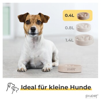 Ein kleiner Hund sitzt auf einem hellen Boden neben drei Haustierschalen mit der Beschriftung 0,4L, 0,8L und 1,4L, mit dem Text "Ideal für kleine Hunde" am unteren Rand.