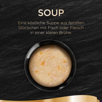 Un bol noir de soupe légère avec de la viande effilochée et des légumes, étiqueté "SOUP" avec une description allemande de ses ingrédients délicieux.