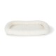 A soft, cream-colored pet bed with a plush, padded interior and raised edges, designed for comfort and support.