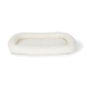 Een zacht, crème-kleurig hondenbed met een pluche, gevoerde binnenkant en verhoogde randen, ontworpen voor comfort en ondersteuning.
