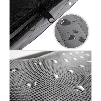 Nahaufnahme einer wasserdichten Haustiermatte, die Wassertropfen auf einer strukturierten schwarzen Oberfläche zeigt, mit einem Reißverschlussdetail oben.