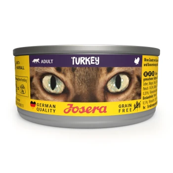 Katzenfutterdose mit einer Nahaufnahme der Katzenaugen, beschriftet mit "Truthahn," "Erwachsene," und "Anti-Haarball," mit "Getreidefrei" und "Deutsche Qualität."