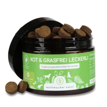 Braune Hundeleckerlis in einem schwarzen Glas mit grünem Etikett, beschriftet mit "KOT & GRASFREI LECKERLI," für Hunde, 300g.
