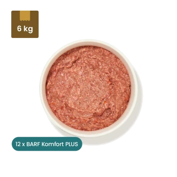 Verpackung von gefrorenem Hundefutter mit der Aufschrift 'Barf Komfort PLUS Huhn' mit einem Nettogewicht von 500 g, mit Zutaten und Nährwertinformationen auf der Rückseite.
