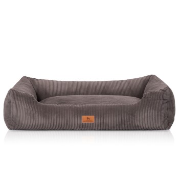 Graues Cord-Haustierbett mit erhöhten Rändern und einem Lederschild mit einer Hundesilhouette.