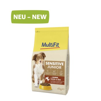 Dog food bag labeled "MultiFit Sensitive Junior" featuring a puppy, with text indicating it contains lamb, chicken, and rice, 4 kg.