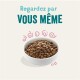 Bol de nourriture pour animaux rempli de croquettes, avec le texte "Regardez par VOUS MÊME" au-dessus en accents teal et rose.