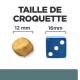 Image comparant les tailles de croquettes pour animaux : une croquette ronde de 12 mm à côté d'un dé bleu mesurant 16 mm, avec le texte "TAILLE DE CROQUETTE."