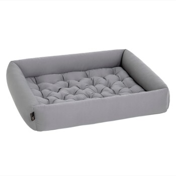 Graues Haustierbett mit einem gepolsterten Design und erhöhten Kanten, das Komfort und Unterstützung für Haustiere bietet.