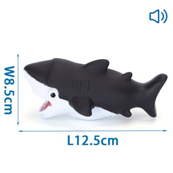 Ein Gummihai-Spielzeug mit schwarzem Oberteil und weißem Bauch, 12,5 cm lang und 8,5 cm breit, mit einem lächelnden Mund.