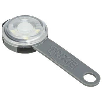 Une cuillère doseuse pour animaux de compagnie Trixie grise avec un dessus circulaire transparent, conçue pour mesurer la nourriture ou les suppléments pour animaux.
