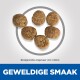 Zes kleine ronde brokjes (4,5 x 8 mm) met de tekst "GEWELDIGE SMAAK" prominent weergegeven.