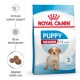 Royal Canin Puppy Medium dog food bag with a puppy image, emphasizing immune support, brain development, and adapted kibble size.