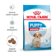 Royal Canin Puppy Medium dog food bag with a puppy image, emphasizing immune support, brain development, and adapted kibble size.