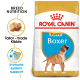 Royal Canin Puppy Boxer dog food bag with a Boxer puppy illustration, emphasizing breed-specific nutrition and immune support.