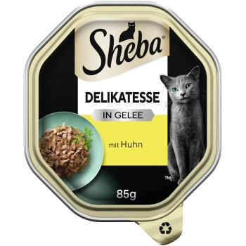 Delikatesse in Gelee 22x85g Huhn Sheba Delikatesse Katzenfutter in Gelee mit Huhn, 85g, mit einer grauen Katze und einer Schüssel mit Futter und Kräutern.