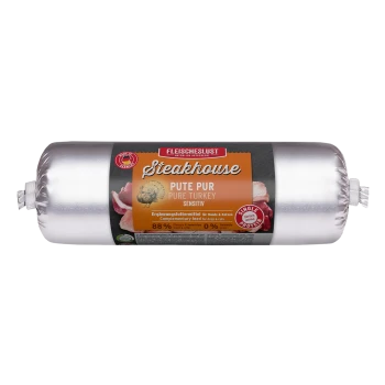 Silberne, wurstähnliche Tierfutterrolle mit Aufschrift 'Fleischeslust Steakhouse Pute Pur / Pure Turkey Sensitiv' — 88% Fleisch, 0% Getreide