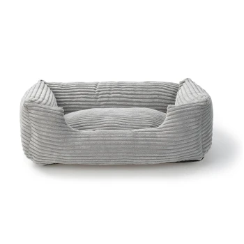 Lit pour animaux de compagnie gris rayé avec bords surélevés et un centre en coussin doux, conçu pour le confort et la détente.