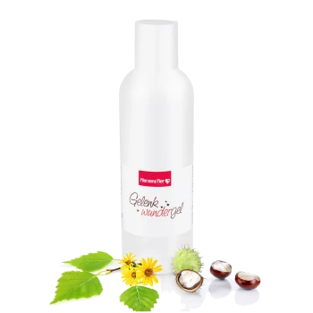 Weiße Flasche HerzensTier Gelenk Wundergel mit gelben Blumen, grünen Blättern und Kastanien auf weißem Hintergrund.