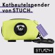 Gelber Hundekotbeutelspender von STUCH, mit einem schwarzen Hundelogo und einem Etikett mit der Aufschrift "Ich bin genehmigt vegan."