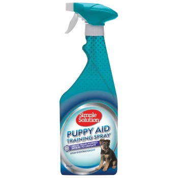 Flasche mit Simple Solution Puppy Aid Training Spray, entwickelt, um Welpen zu trainieren, wo sie urinieren sollen, mit einem Welpenbild.