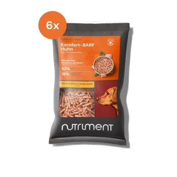 Rohe Hühner-Hundefutterverpackung mit der Aufschrift "Komfort-BARF Huhn", die 82 % Hühnerprotein, 18 % andere Zutaten und ein Foto eines Hundes zeigt.