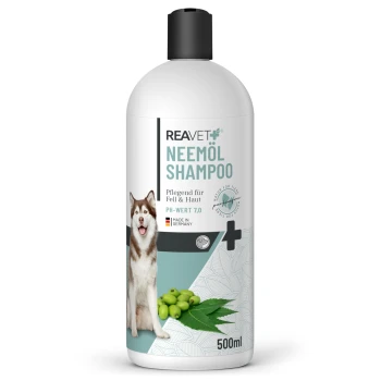 Flasche mit REAVET Neemöl-Shampoo für Hunde, mit einer Husky-Illustration, pH 7.0, 500 ml und deutschem Text zur Haut- und Fellpflege.