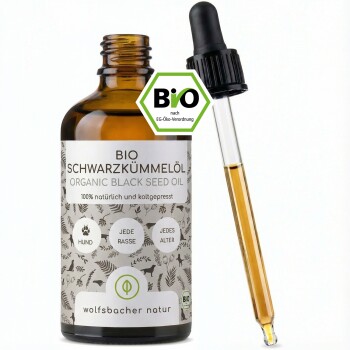Braune Glasflasche mit biologischem Schwarzkümmelöl mit Tropfer, beschriftet mit "BIO SCHWARZKÜMMELÖL" für Hunde aller Rassen und Altersgruppen.