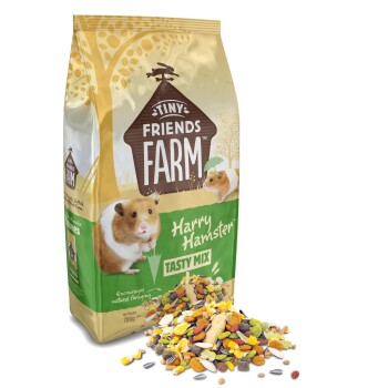 Tiny Friends Farm Harry Hamster Tasty Mix 700g bag with hamster food pile, encourages natural foraging.