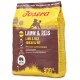 JOSERA Lamm & Reis Hundefutterbeutel, 900g, mit einer Silhouette eines Hundes, mit Text, der das glutenfreie Rezept und die leichte Verdauung hervorhebt.